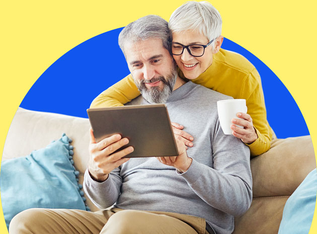 Man and Woman Looking at a Device